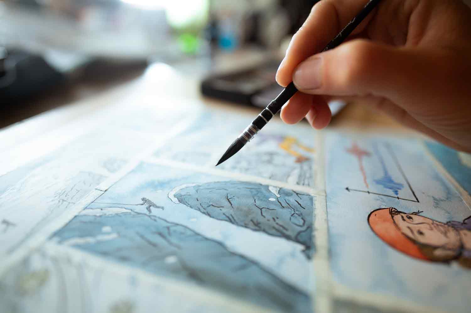 Mise en couleur d’une planche de BD au pinceau.