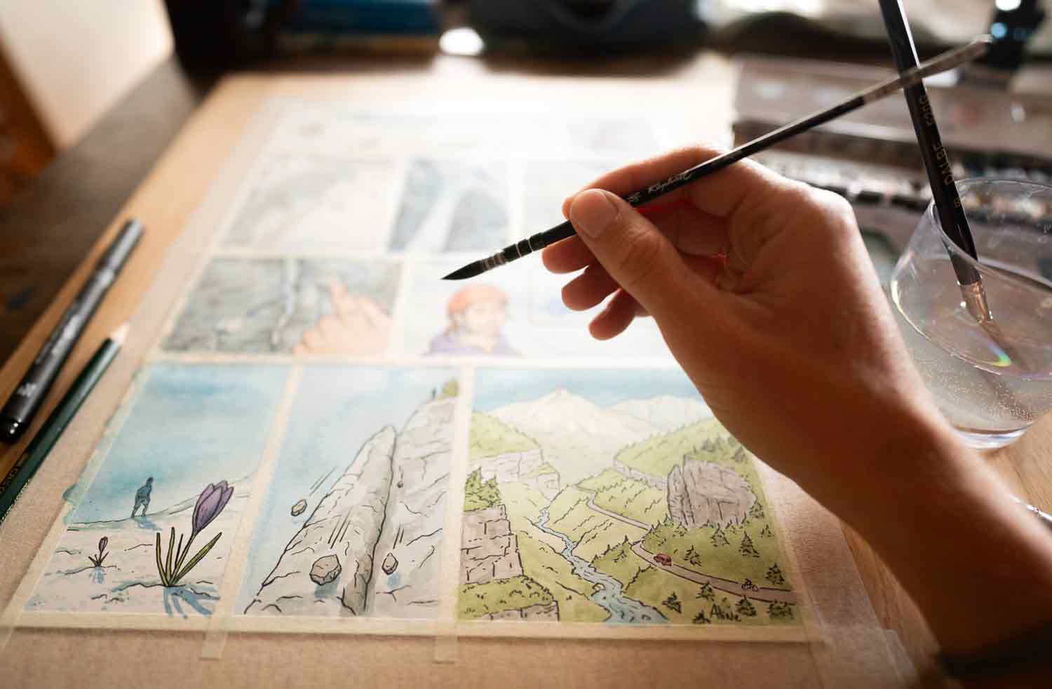 Application de l’aquarelle sur une planche de BD.